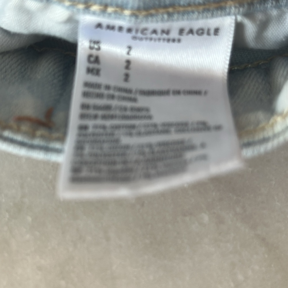 American Eagle Next Level Stretch Hi Rise Shortie Denim Shorts - Picture 3 of 12